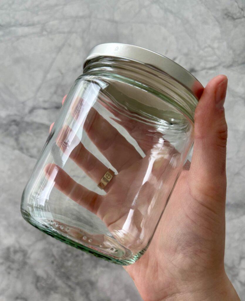 empty glass jar used for pickled red onions