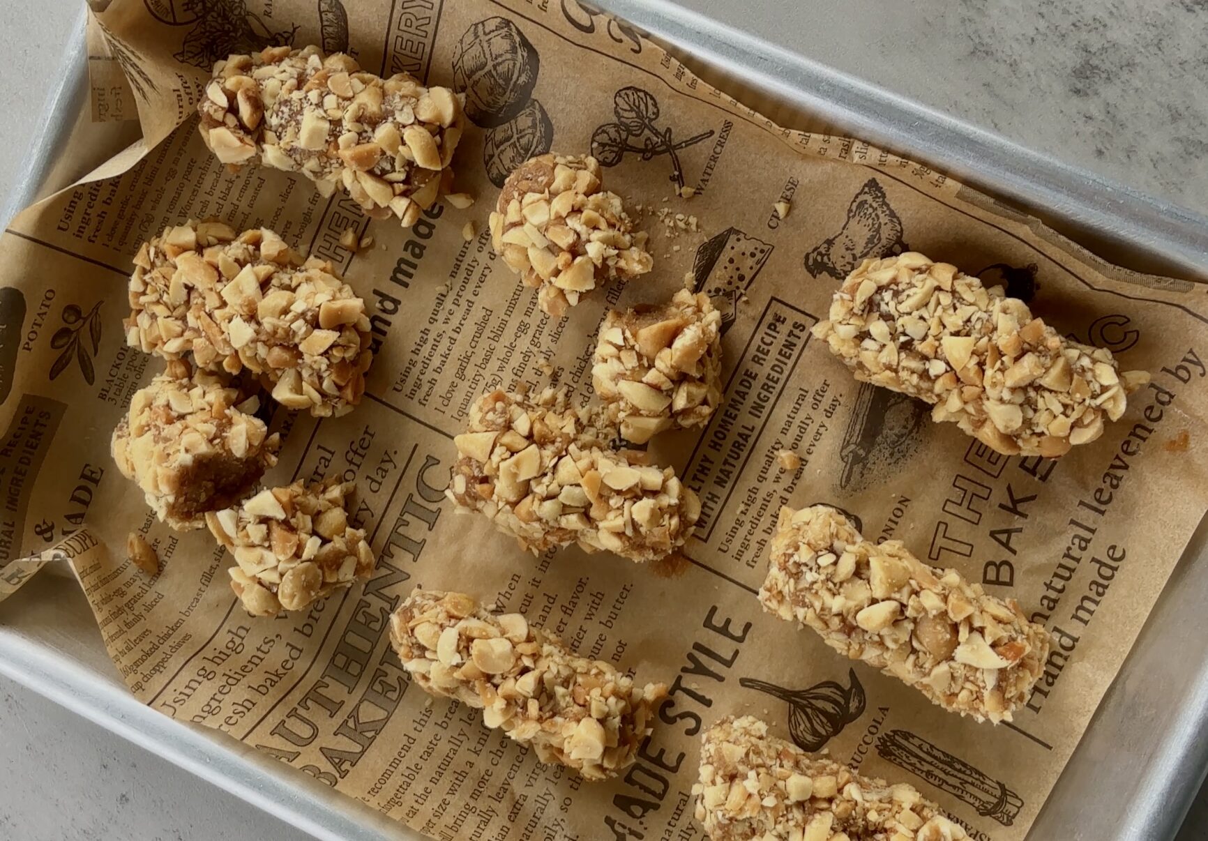 payday candy bar recipe made with dates and peanuts: bars laying on small baking sheet