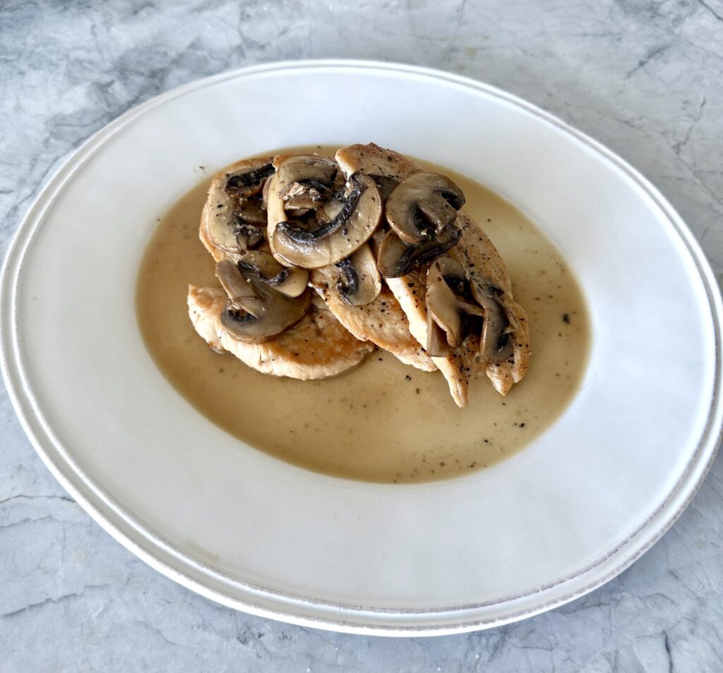 white wine chicken and mushrooms plated