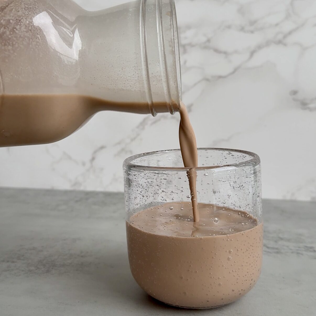 pouring chocolate almond milk